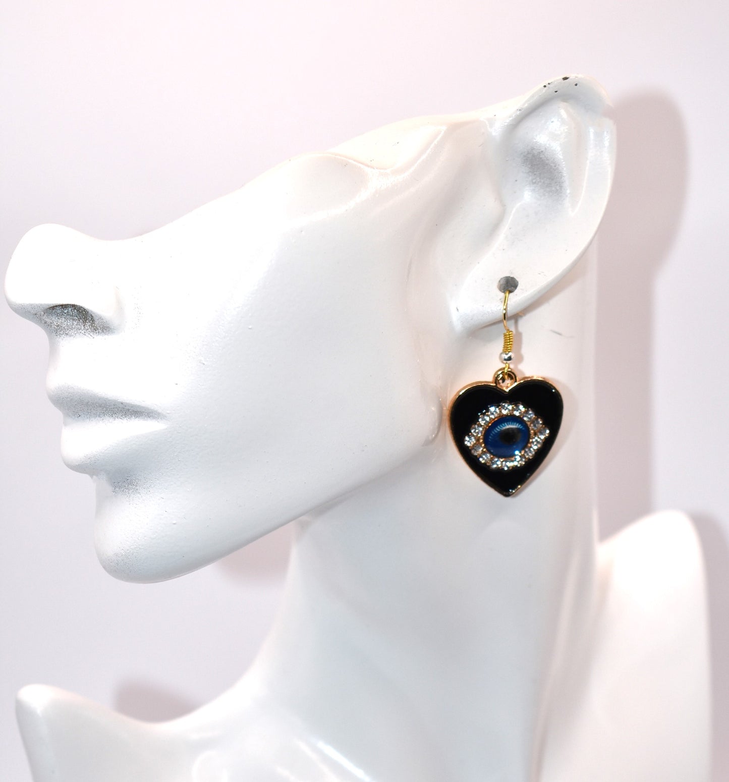 Introducing our Blue Collection, featuring our stunning evil eye earrings. These hypoallergenic earrings not only make a statement, but also provide protection from evil eyes. The black background makes the evil eye pop, adding a touch of beauty to your look. (You'll literally be turning heads)