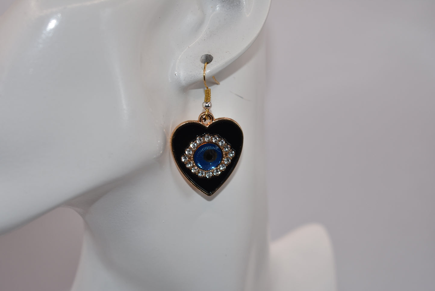 Introducing our Blue Collection, featuring our stunning evil eye earrings. These hypoallergenic earrings not only make a statement, but also provide protection from evil eyes. The black background makes the evil eye pop, adding a touch of beauty to your look. (You'll literally be turning heads)