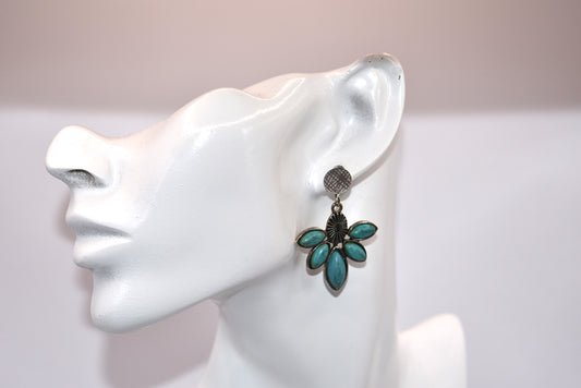 Add a playful pop to your jewelry collection with our Western Collection. These unique silver round post earrings feature pretty turquoise marquise shaped stones, perfect for sensitive ears (hypoallergenic).