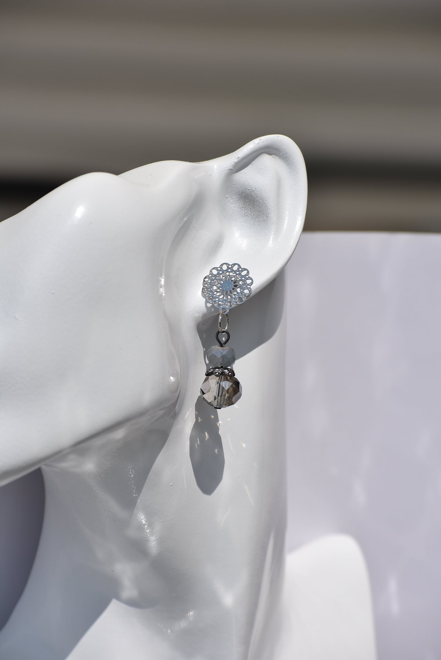 The Gray Collection 5 features filigree posts adorned with grey crystals and beads, perfect for everyday elegance. High-quality materials and intricate designs ensure a stylish and durable product, while classic hues add timeless beauty to any look.