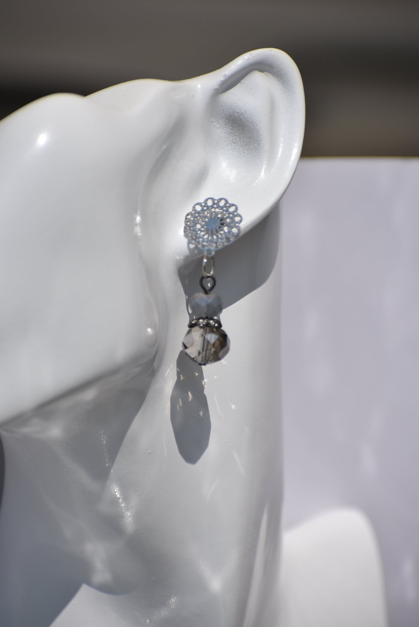 The Gray Collection 5 features filigree posts adorned with grey crystals and beads, perfect for everyday elegance. High-quality materials and intricate designs ensure a stylish and durable product, while classic hues add timeless beauty to any look.