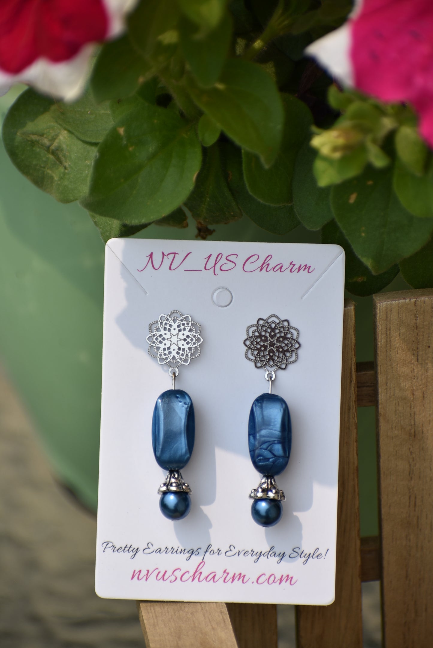 The Blue Collection 12 earrings are a unique and timeless piece crafted with beautiful sapphire blue pearl and beads, coupled with a silver filigree post. With their elegant and classic design, you'll be sure to turn heads.