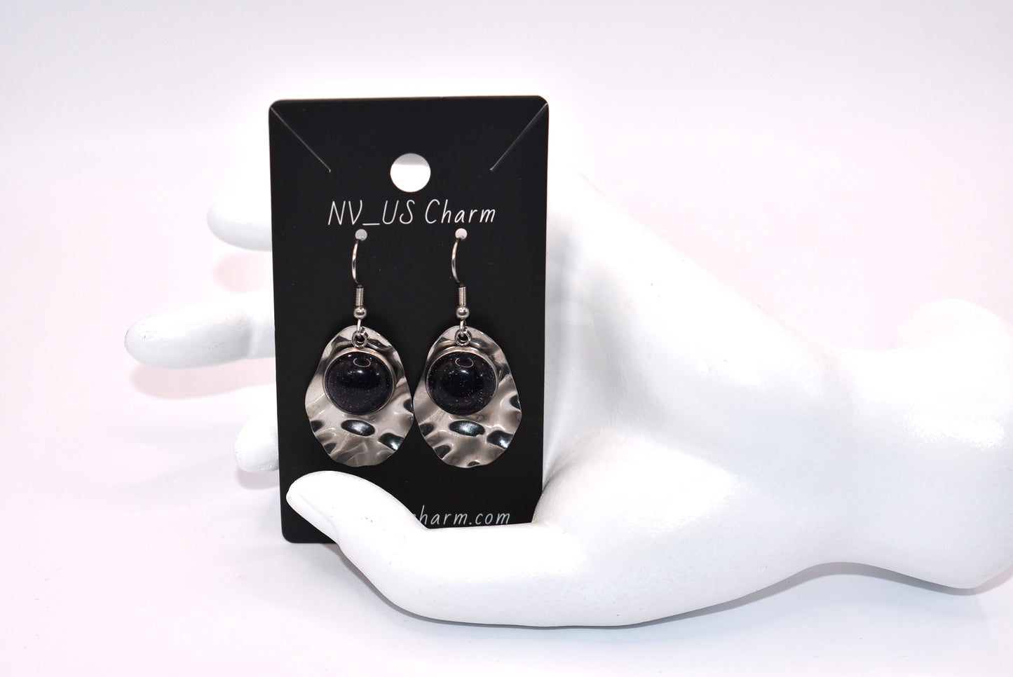 Add some playfulness to your collection with these gorgeous dark blue cabochon earrings. With a subtle sparkle and sturdy stainless-steel posts and backing, they are perfect for any occasion. Come check out these beauties!&nbsp; These earrings are hypoallergenic for sensitive ears.&nbsp;&nbsp;