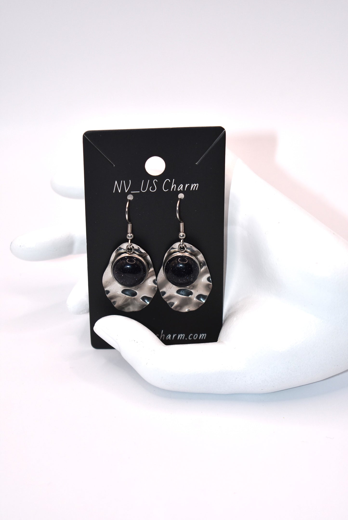 Add some playfulness to your collection with these gorgeous dark blue cabochon earrings. With a subtle sparkle and sturdy stainless-steel posts and backing, they are perfect for any occasion. Come check out these beauties!&nbsp; These earrings are hypoallergenic for sensitive ears.&nbsp;&nbsp;