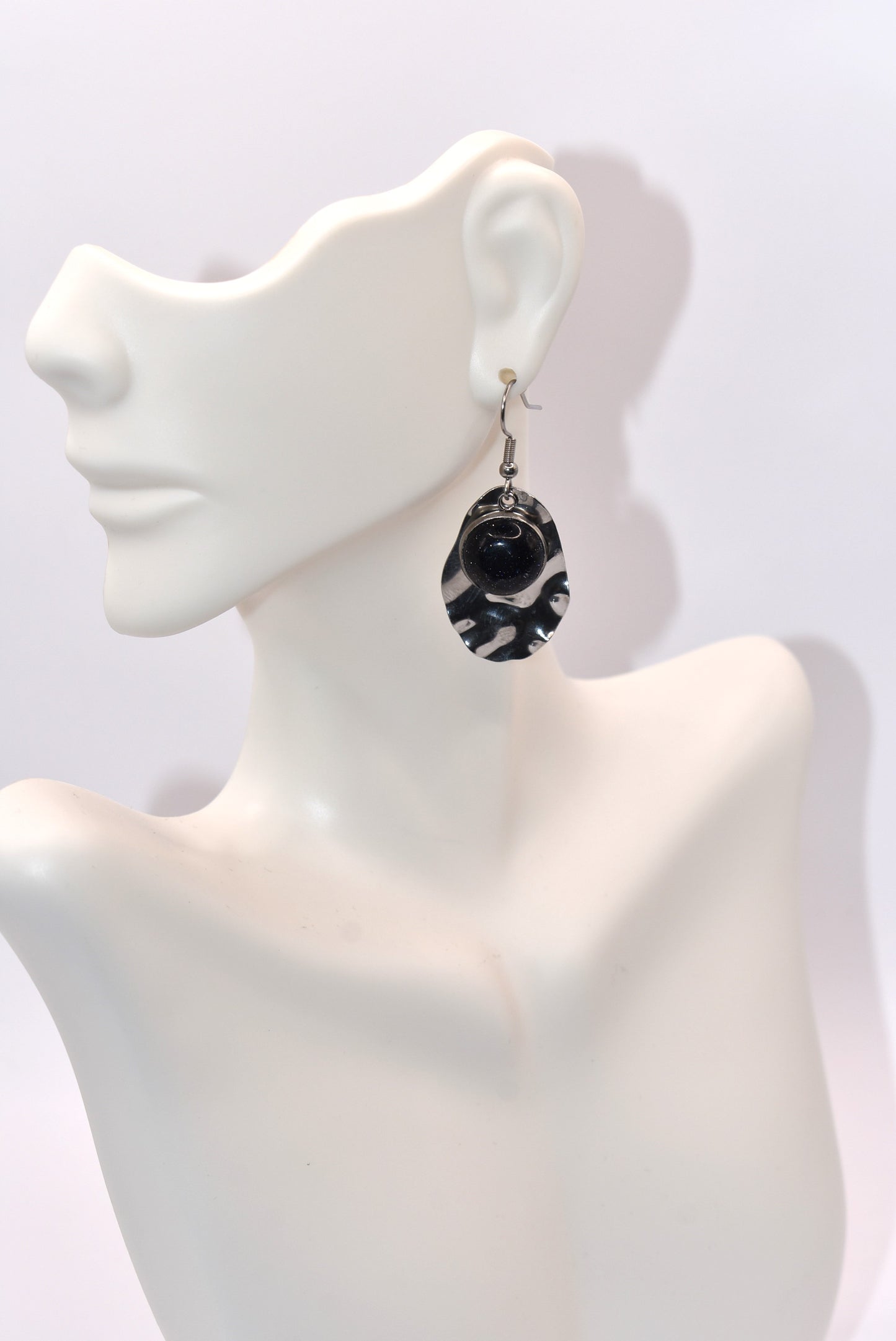 Add some playfulness to your collection with these gorgeous dark blue cabochon earrings. With a subtle sparkle and sturdy stainless-steel posts and backing, they are perfect for any occasion. Come check out these beauties!&nbsp; These earrings are hypoallergenic for sensitive ears.&nbsp;&nbsp;