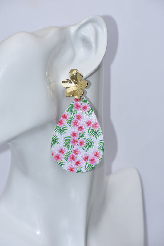 Add a tropical touch to your style with our Key West Collection earrings! These teardrop earrings feature a unique faux leather tropical flower design, hanging from a gold-filled flower post for maximum comfort. Perfect for any getaway, these earrings will elevate your style while keeping you stylish and comfortable.