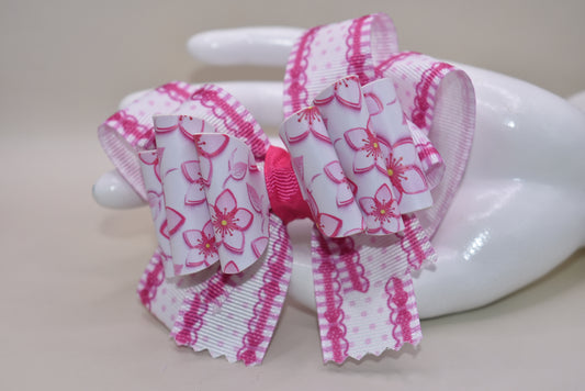 Add a pop of playful charm with this Nana' Collection 100 hair clip! Featuring a pretty pink flower made from soft faux leather, it’s perfectly framed by matching grosgrain ribbon for extra sweetness. The wrapped alligator clip ensures a comfy, secure hold all day long. 🌸🎀✨ Perfect for brightening up any hairstyle with a touch of fun!