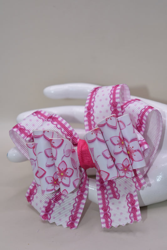 Add a pop of playful charm with this Nana' Collection 100 hair clip! Featuring a pretty pink flower made from soft faux leather, it’s perfectly framed by matching grosgrain ribbon for extra sweetness. The wrapped alligator clip ensures a comfy, secure hold all day long. 🌸🎀✨ Perfect for brightening up any hairstyle with a touch of fun!