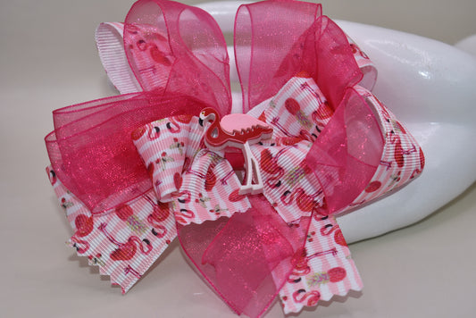 Add a splash of fun with Nana's Collection 104! 🌸 This playful hair clip features a pretty flamingo ribbon in vibrant hot pink, paired with hot pink chiffon that matches perfectly. 🦩 The wrapped alligator clip ensures comfy, easy wear for your little flamingo fans. Perfect for brightening up any day with a touch of tropical charm! 🌺✨