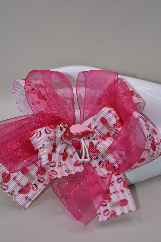 Add a splash of fun with Nana's Collection 104! 🌸 This playful hair clip features a pretty flamingo ribbon in vibrant hot pink, paired with hot pink chiffon that matches perfectly. 🦩 The wrapped alligator clip ensures comfy, easy wear for your little flamingo fans. Perfect for brightening up any day with a touch of tropical charm! 🌺✨