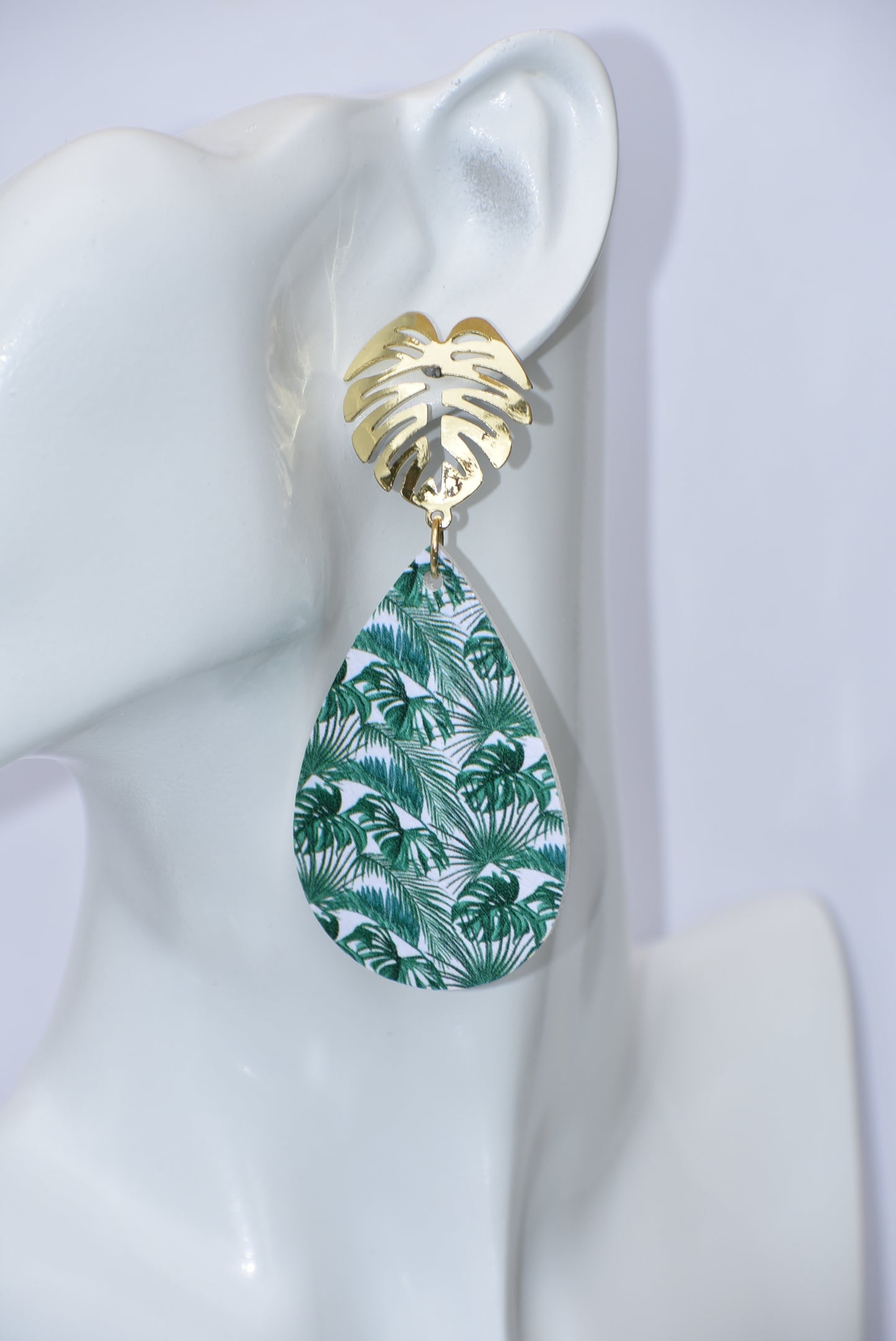 Add a touch of tropical vibes to your look with our Key West Collection. These pretty faux leather teardrops feature a unique palm tree gold filled post, perfect for all the palm tree lovers out there! With these earrings, you'll bring the beach anywhere you go." 🏝️🌴🌺