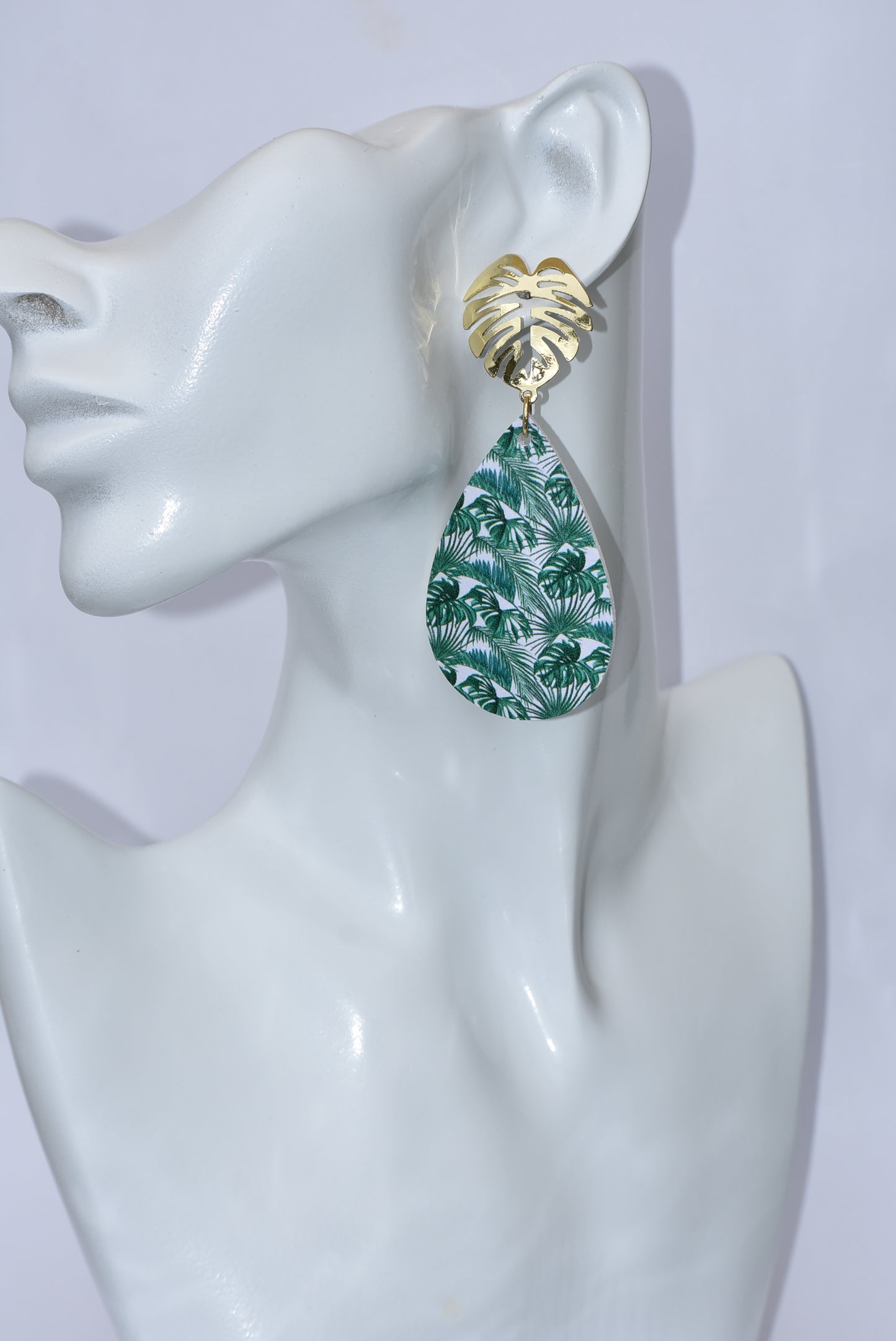 Add a touch of tropical vibes to your look with our Key West Collection. These pretty faux leather teardrops feature a unique palm tree gold filled post, perfect for all the palm tree lovers out there! With these earrings, you'll bring the beach anywhere you go." 🏝️🌴🌺