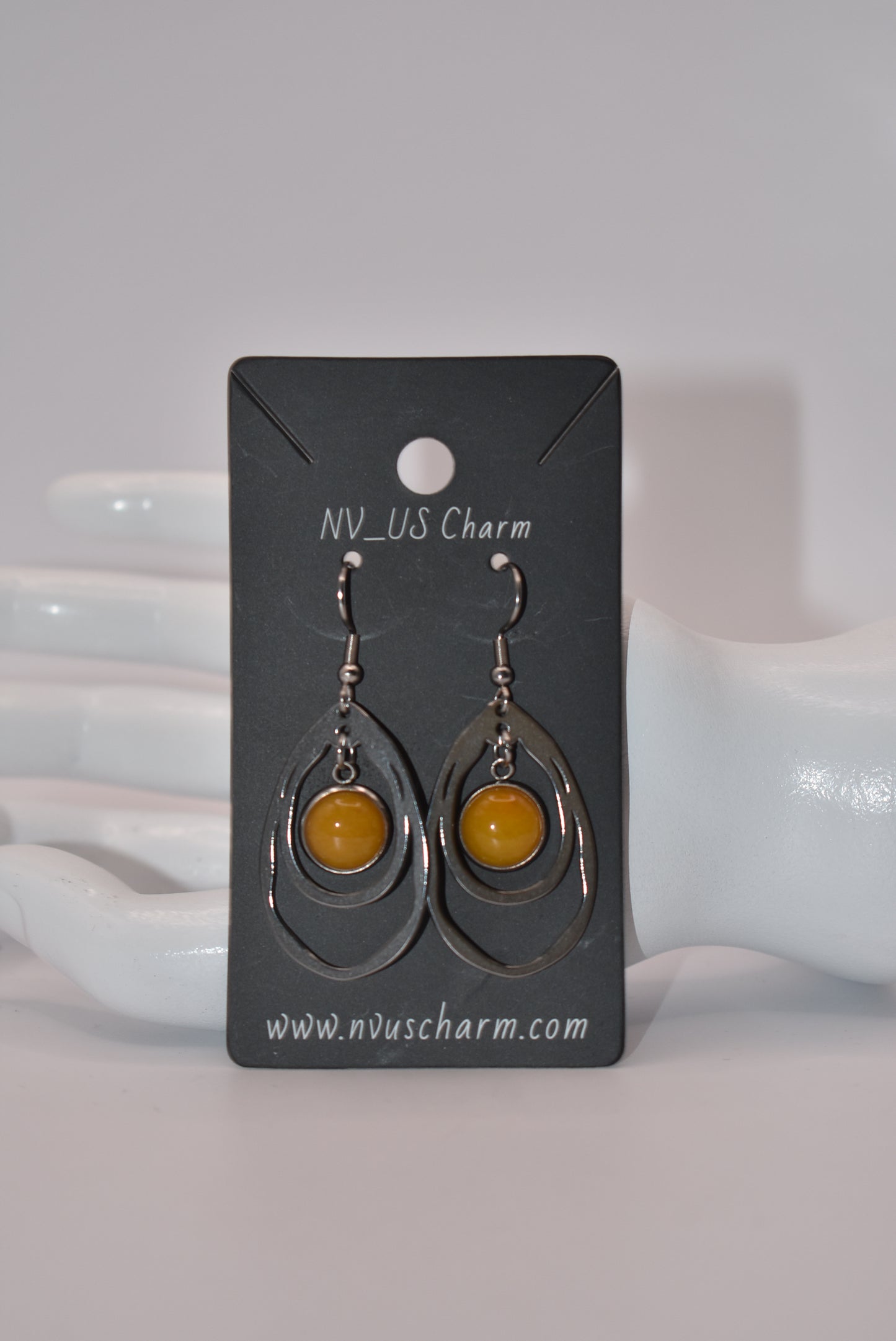 Add a touch of sunshine to your outfit with our Yellow Collection earrings. Made with hypoallergenic stainless-steel hooks, these beautiful hanging earrings feature a stunning cabochon stone in a bright and bold yellow hue. So comfortable and stylish, they'll make your look pop!