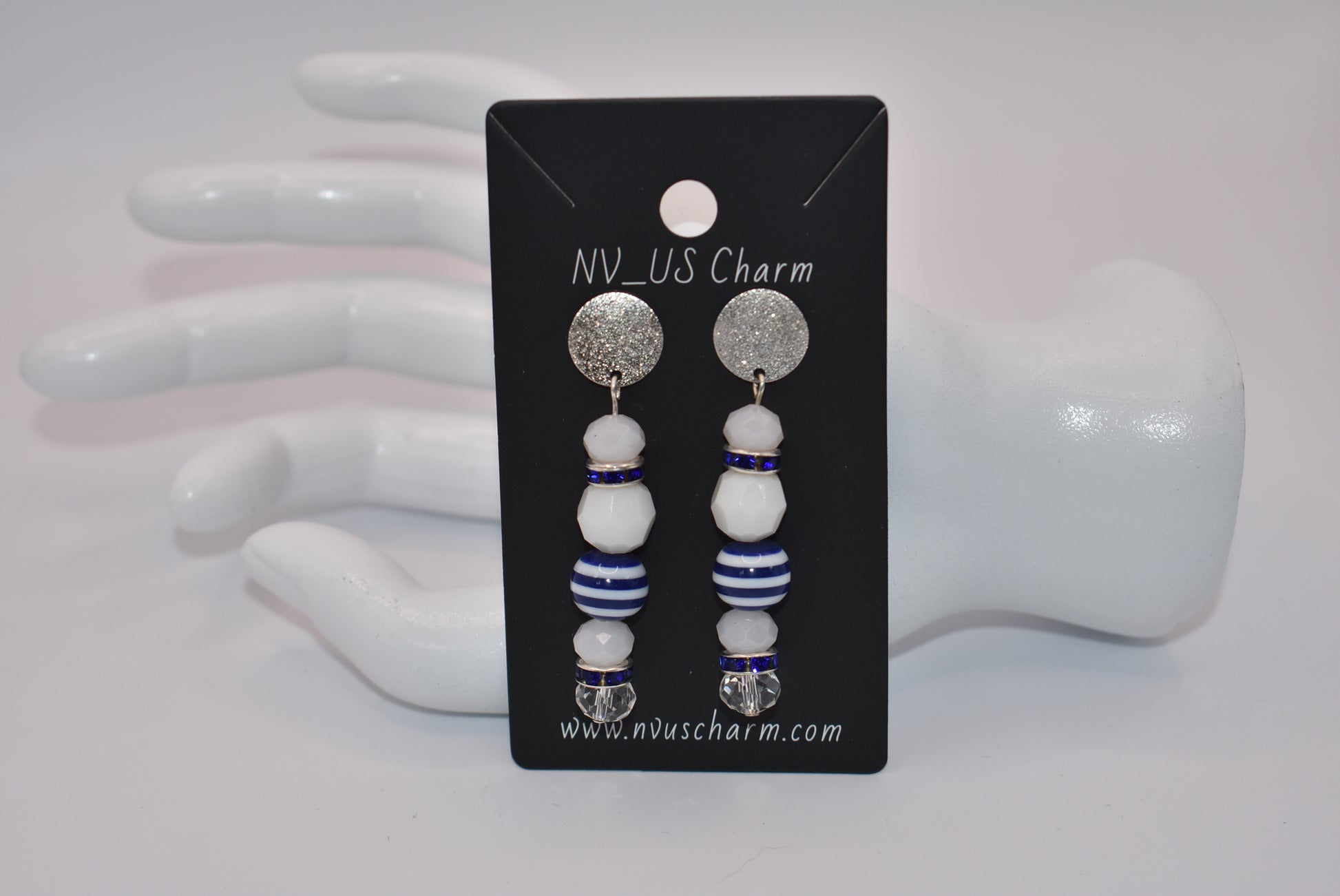 Step aboard and add a touch of sparkle to your nautical wardrobe with our one-of-a-kind Nautical Collection earrings. The silver, hypoallergenic, sparkly posts and mix of white and blue beads and crystals add a playful yet stylish touch to any outfit. "Sea" for yourself!