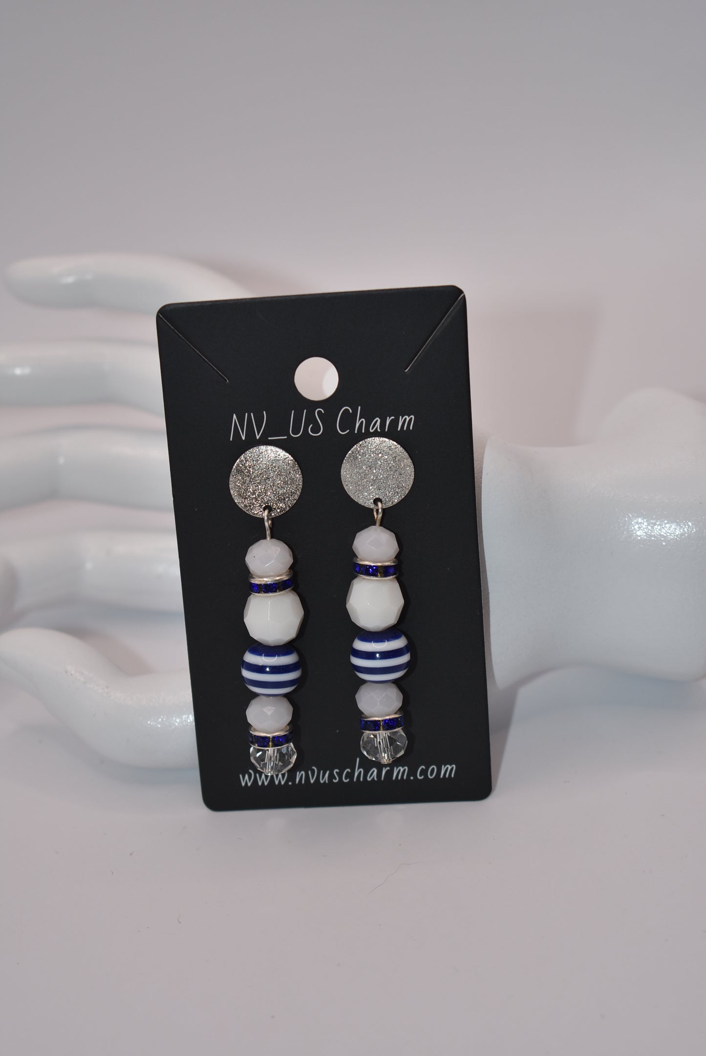 Step aboard and add a touch of sparkle to your nautical wardrobe with our one-of-a-kind Nautical Collection earrings. The silver, hypoallergenic, sparkly posts and mix of white and blue beads and crystals add a playful yet stylish touch to any outfit. "Sea" for yourself!