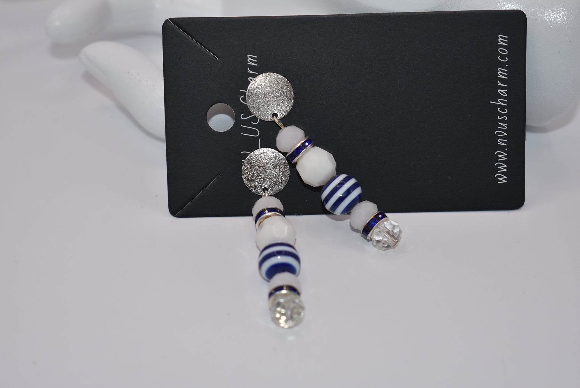 Step aboard and add a touch of sparkle to your nautical wardrobe with our one-of-a-kind Nautical Collection earrings. The silver, hypoallergenic, sparkly posts and mix of white and blue beads and crystals add a playful yet stylish touch to any outfit. "Sea" for yourself!