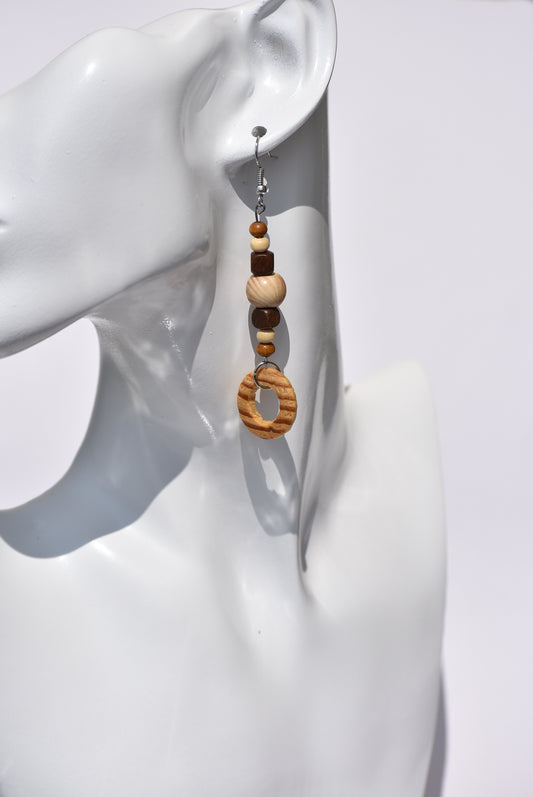 Every shade of brown represented here.  On the long side but definitely comfortable are these silver hanging earrings.  Made of different shades of wood beads. This is a One-of-a-kind piece.