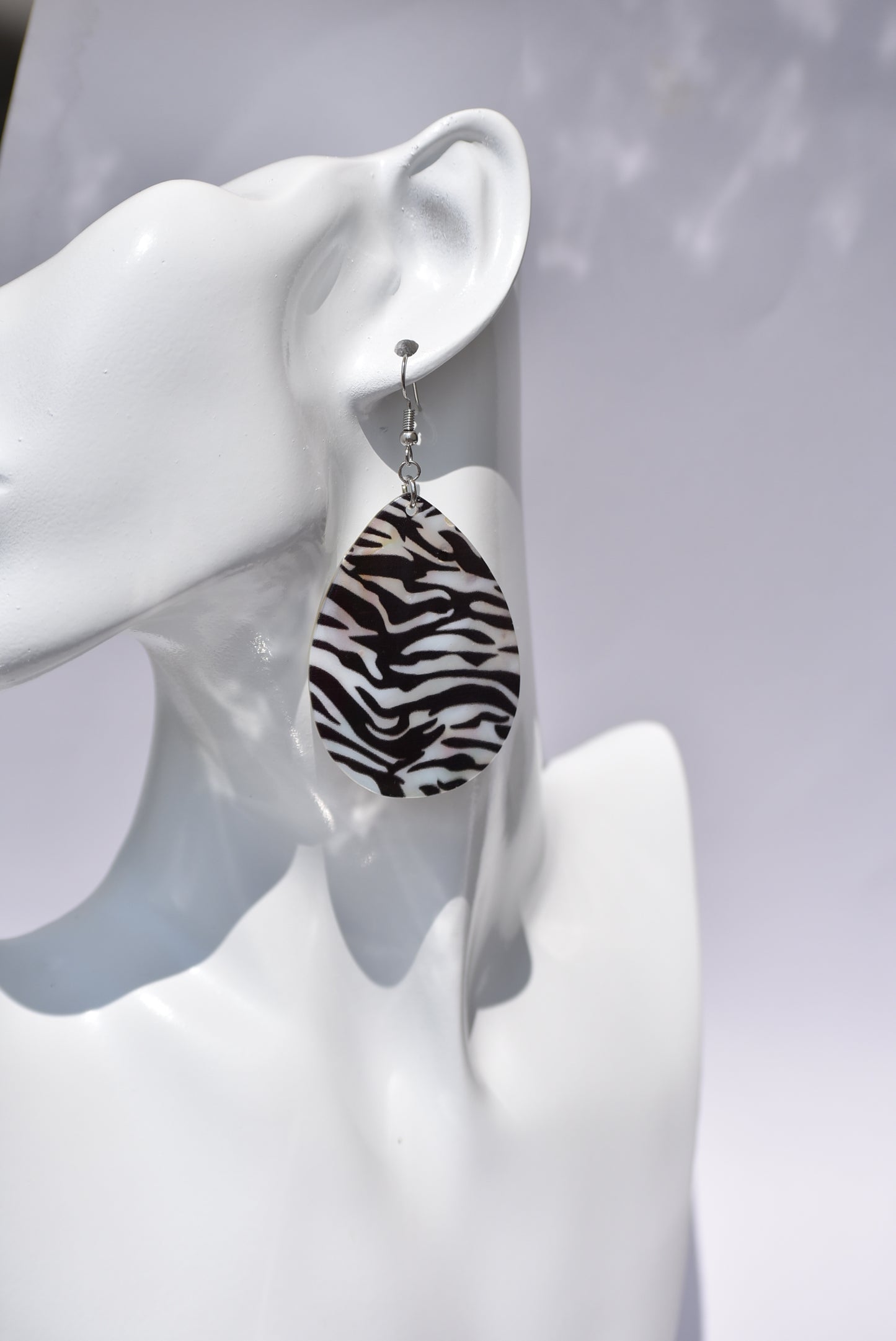 his Zebra pattern hanging earring is perfect for a fancy dress or just a pair of jeans. 