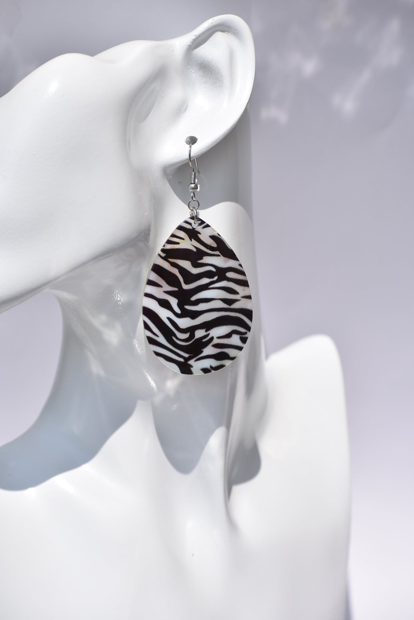 his Zebra pattern hanging earring is perfect for a fancy dress or just a pair of jeans. 