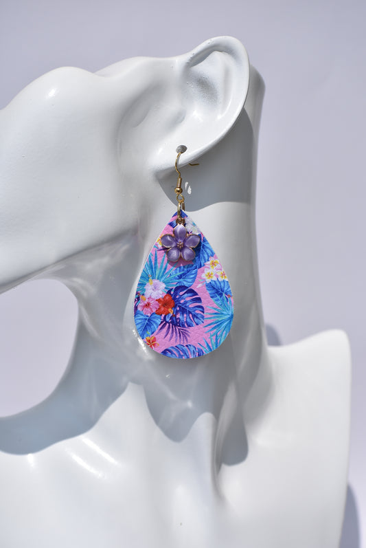 Beautiful shades of color bring these teardrop earrings to life.  They have a purple flower charm hanging from the top to add that little bit of extra color to these earrings.  They hang on gold hooks for comfort.  