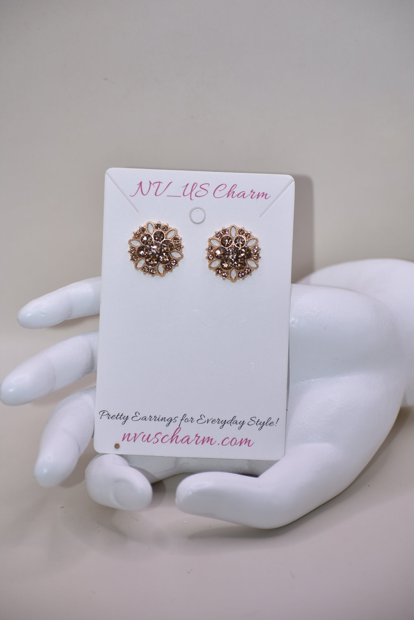 These charming auburn crystal flower earrings add a touch of elegance to your wedding look. The hypoallergenic gold posts provide all-day comfort for sensitive ears. Fall in love with the perfect amount of bling.