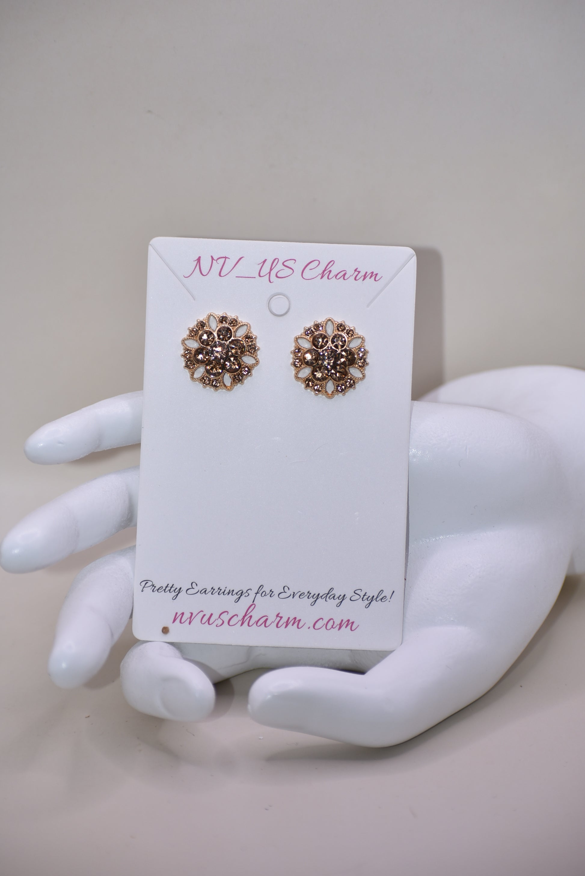 These charming auburn crystal flower earrings add a touch of elegance to your wedding look. The hypoallergenic gold posts provide all-day comfort for sensitive ears. Fall in love with the perfect amount of bling.