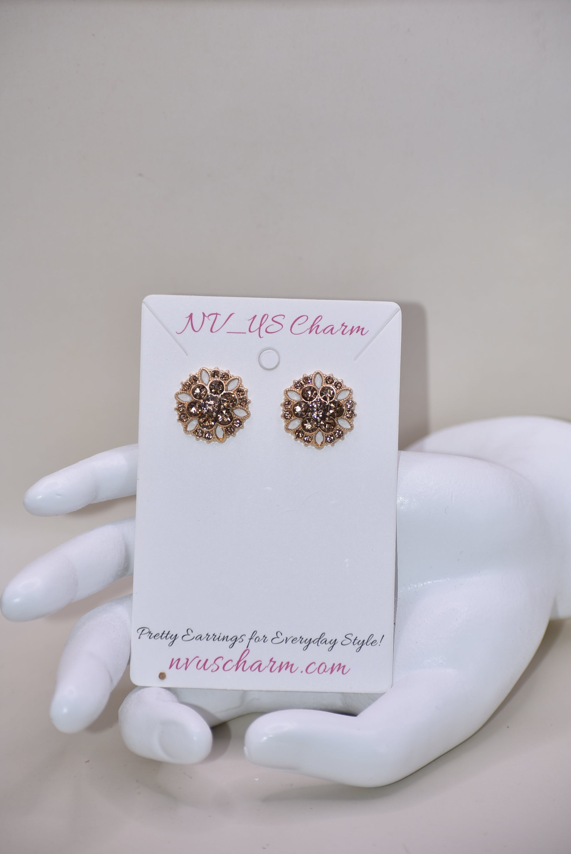 These charming auburn crystal flower earrings add a touch of elegance to your wedding look. The hypoallergenic gold posts provide all-day comfort for sensitive ears. Fall in love with the perfect amount of bling.