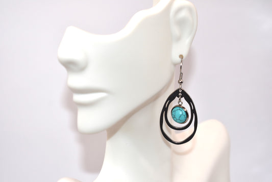 Add a touch of Western charm to any outfit with our beautiful turquoise cabochon hoop earrings. The stainless-steel hypoallergenic hooks ensure comfort while the two-tiered design adds the perfect amount of flair. Versatile and stylish, these earrings will become your go-to accessory!