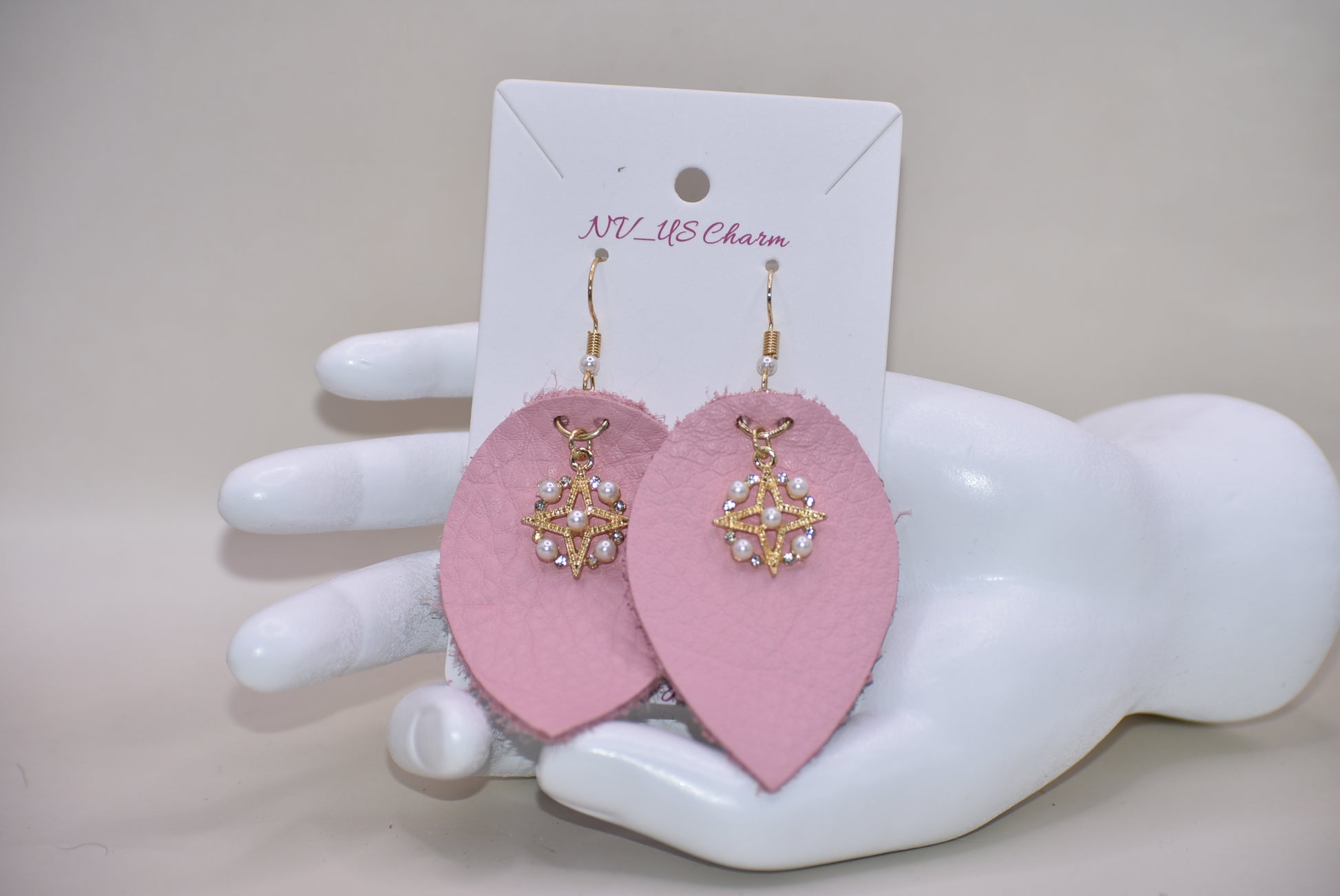 Make a statement with our Pink Collection! These adorable earrings feature pink soft faux leather teardrops and a pretty pearl charm, perfect for adding a touch of sweetness to any outfit. The hypoallergenic gold filled hooks make them suitable for even the most sensitive ears.