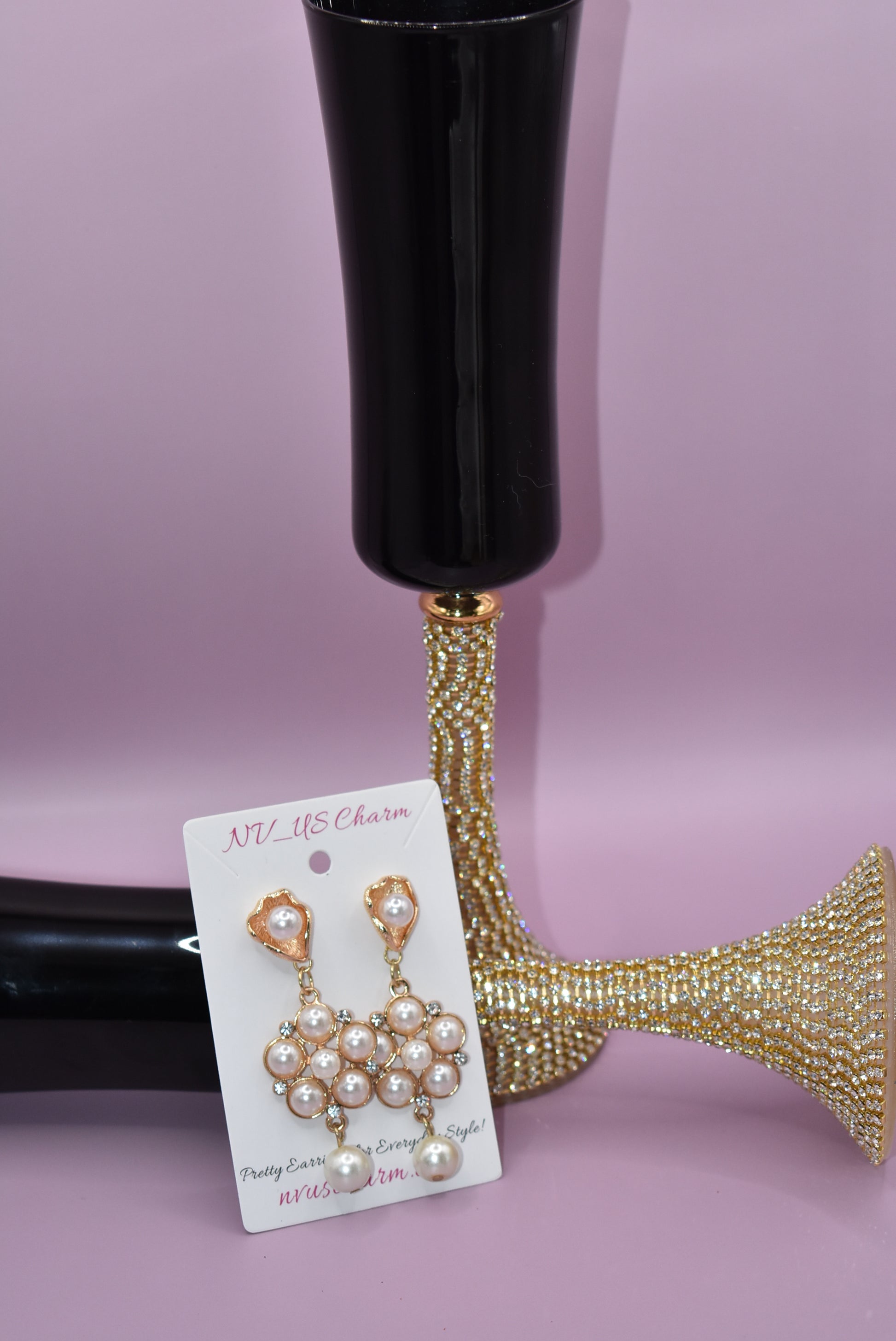 This luxurious Wedding Collection 13 features prestigious posts crafted from pearl and gold that hold a stunning cluster of pearls and crystals. A single suspended pearl adds an elegant finishing touch. Perfect for special occasions or any time you want to make a statement.