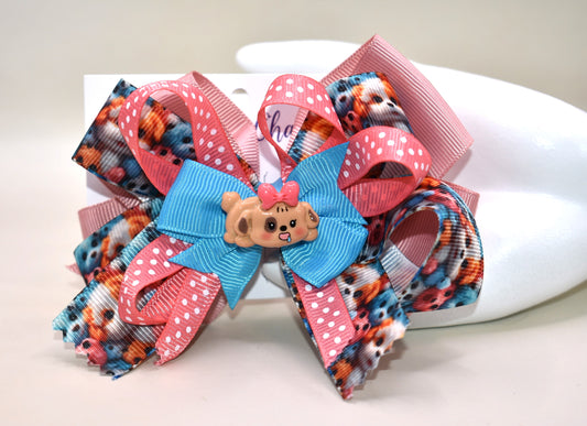 Add a splash of fun with this adorable dog charm from Nana's Collection! Featuring layers of a cute pup and a cheerful polka dot ribbon, it clips on easily with a wrapped alligator clip—perfect for quick, playful style. 🐶🎀 Clip it on and let the smiles begin!