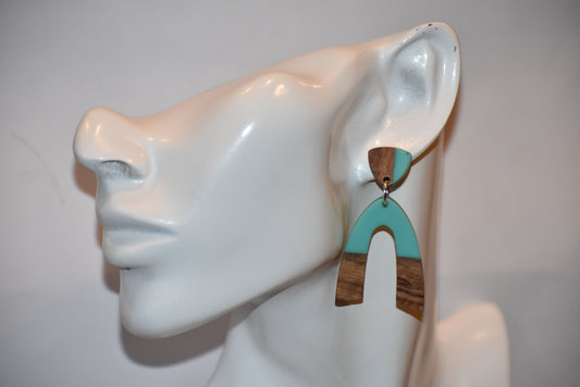 "Add some fun and style to your jewelry collection with our Green Collection! Our matching wood and resin posts perfectly hold our unique u-shaped wood and resin dropped earrings. A playful and stylish addition to any outfit. (Side effects may include compliments and envious stares.)"