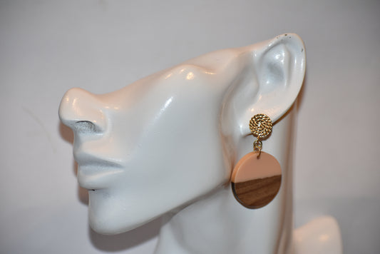 Get ready to elevate your style with our Orange Collection! These gold-filled rope post earrings are not only hypoallergenic for sensitive ears, but also super pretty on the ear. And don't miss out on our soft peach resin and wood round hanging earrings, perfect for adding a touch of uniqueness to any outfit.