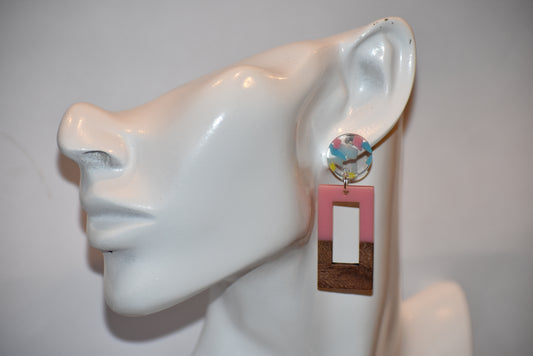 Get ready to add some fun and quirkiness to your style with our Pink Collection! These super fun wood and resin rectangle drop earrings are a perfect addition to any outfit. The clear resin round post earrings are speckled with pink, yellow, and blue pieces, making them a unique and playful accessory. Dress them up or down, they will look cute on your ears either way!