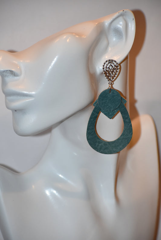 Add a pop of color to any outfit with our Green Collection. These pretty teardrop earrings feature a soft faux leather in a pretty green hue. The square and round accents add a unique touch, while the lightweight design makes them comfortable for all-day wear. Perfect for any occasion!