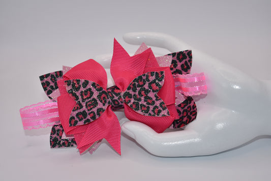 For all my wild little girls out there, Nana's Collection has the perfect bow for you! Made of fun hot pink leopard faux leather and hot pink ribbon, this combination is sure to grab attention. And with the alligator clip for comfort, it's the perfect hair accessory. Let your little one stand out with Nana's Collection!