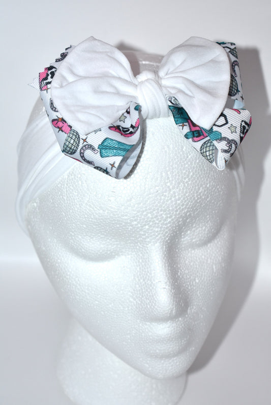 Get ready to ride in style with this pretty white wide headband! Featuring a soft fabric and a charming cowgirl bow in the center, it’s comfortable and perfect for cowgirls of all ages. Add a fun and unique touch to any outfit—giddy up! 🤠🎀💖