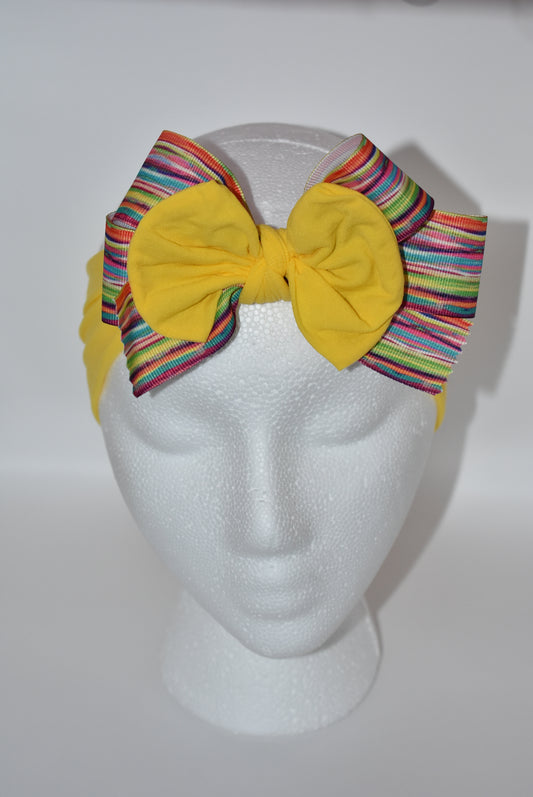 Add a pop of color and fun to any outfit with this wide, soft headband! Bright and pretty, it’s designed to brighten your day and perfectly suits all ages. Featuring a one-of-a-kind pattern, this headband is your go-to for stylish comfort all day long. 🌈✨🎀
