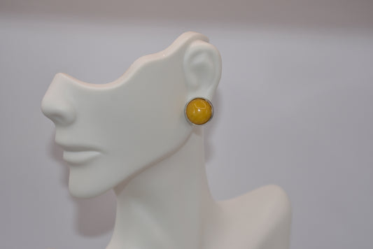 Add a pop of color to your everyday look with our Yellow Collection earrings. Featuring a stunning yellow cabochon stone set in stainless steel hypoallergenic posts, these earrings are sure to make a statement. Elevate your style with the prettiest shade of yellow that you'll love to wear every day!