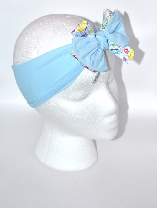 Slip on this adorable powder blue nylon headband and let your style flutter! 🦋 Wrapped in a charming butterfly and flower ribbon, this stretchy beauty hugs comfortably for all-day wear. Whether you're dressing up or keeping it casual, this versatile accessory works with every outfit and suits every age. 🌸 A playful pop of color that's as sweet as it is practical! 