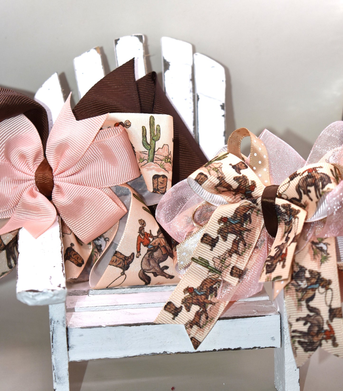 🐴 Calling all little cowgirls! This adorable smaller version of her sister bow brings the perfect mix of ribbon charm with a fun horse riding motif. With a wrapped alligator clip on the back, it’s easy to wear and stay put during all your adventures. You’re sure to fall in love with this cutie—ready to add a bit of playful flair to any outfit! 🎀✨