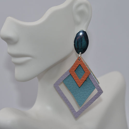 Add a pop of color and whimsy to your outfit with our Orange Collection faux leather earrings. The lightweight design is both playful and comfortable, while the orange, aqua, and lavender color combination is sure to turn heads. Hypoallergenic silver posts and a diamond pattern add the perfect finishing touch.