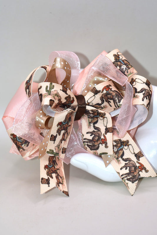 🐴 Calling all little cowgirls! This adorable smaller version of her sister bow brings the perfect mix of ribbon charm with a fun horse riding motif. With a wrapped alligator clip on the back, it’s easy to wear and stay put during all your adventures. You’re sure to fall in love with this cutie—ready to add a bit of playful flair to any outfit! 🎀✨