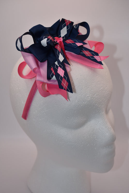 Elevate your style with Nana's Headband Collection! The cool blue, pink and white color combination is perfect for any outfit. The pretty pink satin-wrapped headband adds a touch of elegance, while the layers of quality ribbon give it a unique charm. Say goodbye to boring hair days with this playful and stylish accessory.