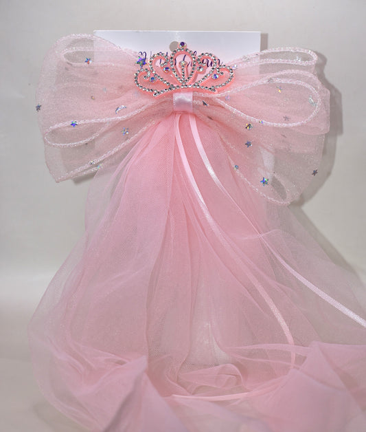Add a touch of royalty with the Long Tail Collection 6 bow. Featuring a charming crown jewel perched atop layers of soft, flowing tulle, this easy clip-on accessory is perfect for anyone dreaming of a princess-worthy look. Effortlessly elevate any outfit with a playful sparkle that delights both kids and adults alike.