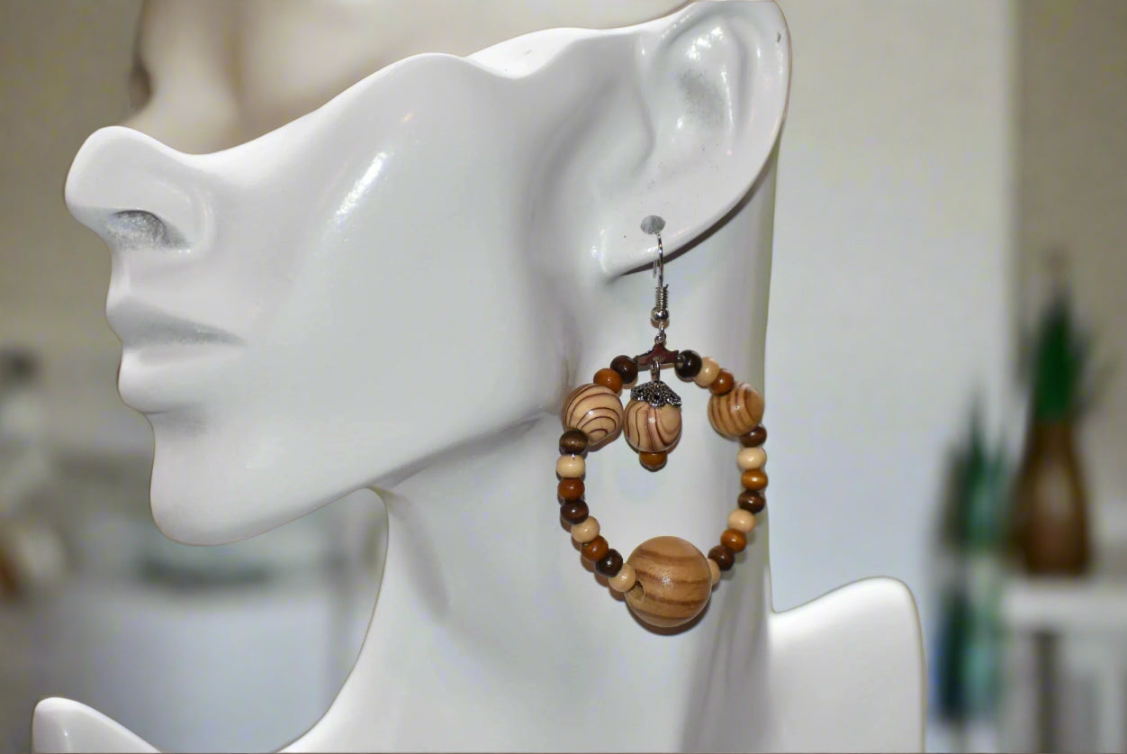 The Brown Collection is for those who want something different for their fall wardrobe. These earrings feature high quality wood beads and hang from hypoallergenic hooks for maximum comfort and convenience. The perfect length ensures that you will get the attention you deserve.