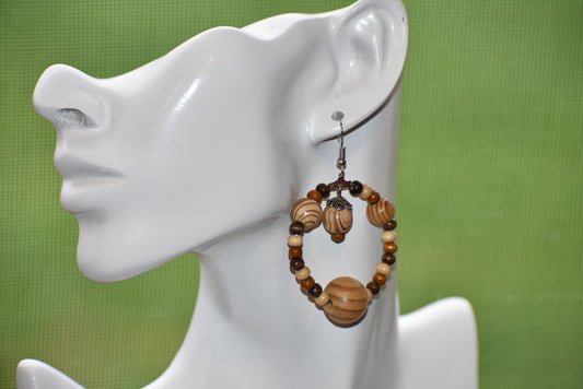 The Brown Collection is for those who want something different for their fall wardrobe. These earrings feature high quality wood beads and hang from hypoallergenic hooks for maximum comfort and convenience. The perfect length ensures that you will get the attention you deserve.