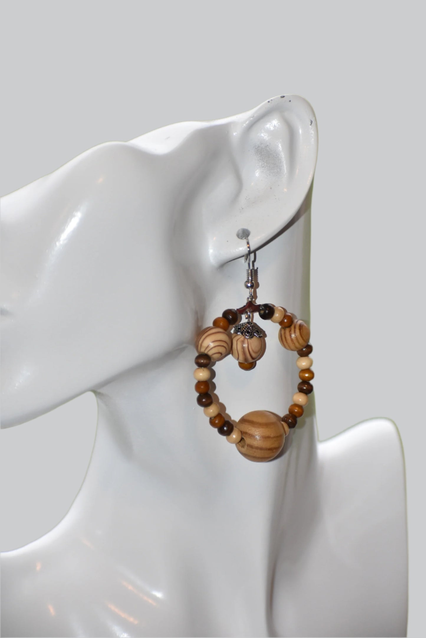 The Brown Collection is for those who want something different for their fall wardrobe. These earrings feature high quality wood beads and hang from hypoallergenic hooks for maximum comfort and convenience. The perfect length ensures that you will get the attention you deserve.