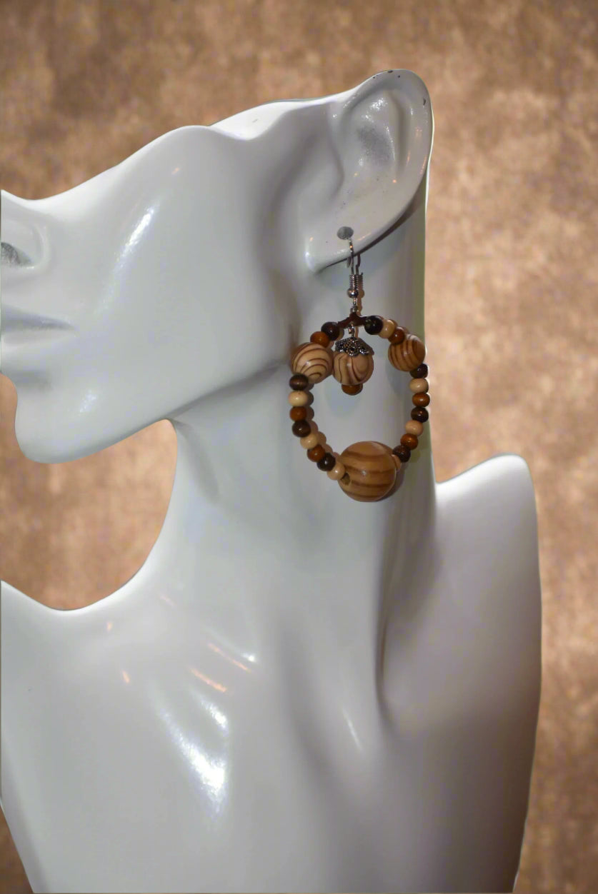 The Brown Collection is for those who want something different for their fall wardrobe. These earrings feature high quality wood beads and hang from hypoallergenic hooks for maximum comfort and convenience. The perfect length ensures that you will get the attention you deserve.