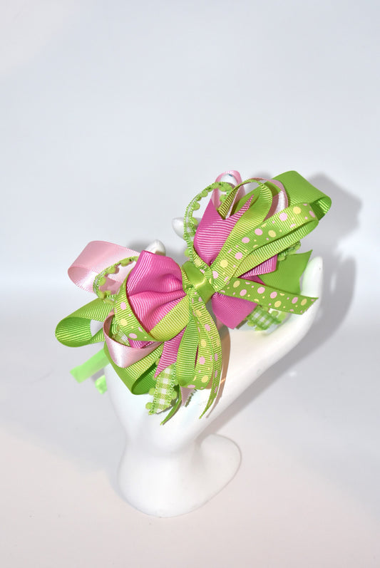 Wrap your hair in pure charm with this one-of-a-kind headband! ✨ Featuring delicate layers of pretty ribbon in a gorgeous green and pink color mix, this skinny satin headband is designed for all-day comfort and style. 🎀 Whether you're heading to work, running errands, or enjoying a casual day out, this beauty keeps your look polished without the fuss. 💚💗 Perfect for anyone who loves a pop of color and a touch of whimsy!